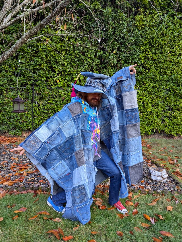 Neal Nesbitt in a cloak made of jean pockets